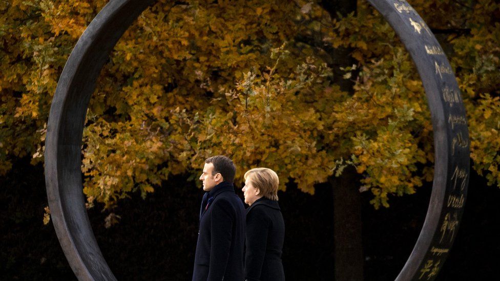 French President Emmanuel Macron and German Chancellor Angela Merkel attend a ceremony at the glaze of the Forest of Rethondes in Compiegne, France, 10 November 2018