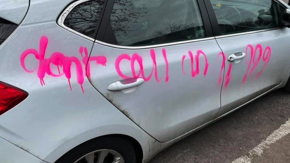 Car covered in graffiti