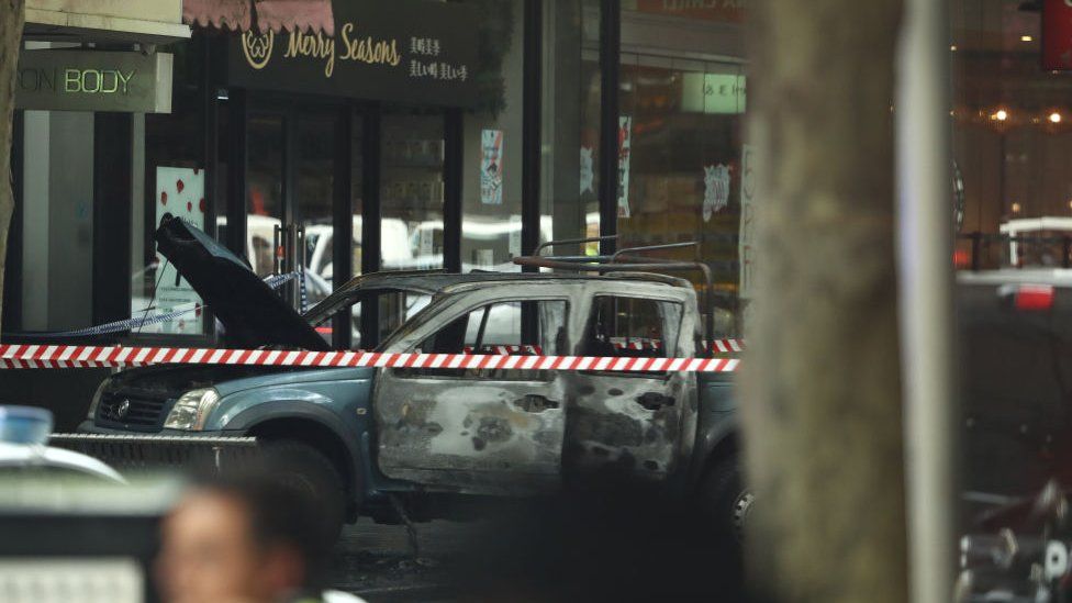 A burnt out vehicle is seen in Bourke St on November 09, 2018 in Melbourne, Australia