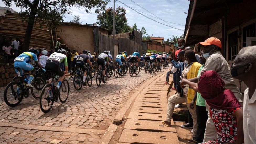 Residents gather to watch cyclists competing during the final stage of the 14th Tour du Rwanda on 27 February 2022 in Kigali, Rwanda