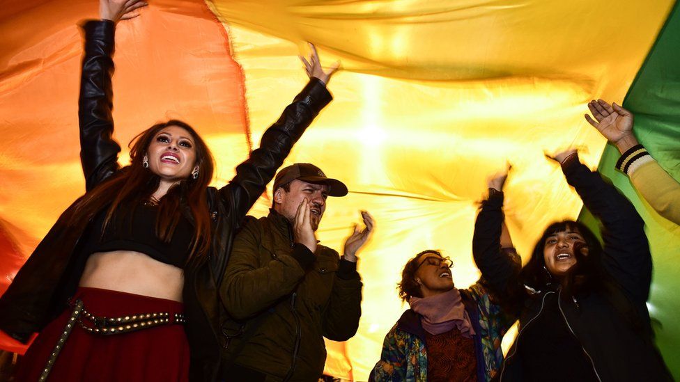 People celebrates after the Ecuador's Constitutional Court approved equal civil marriage, in Quito