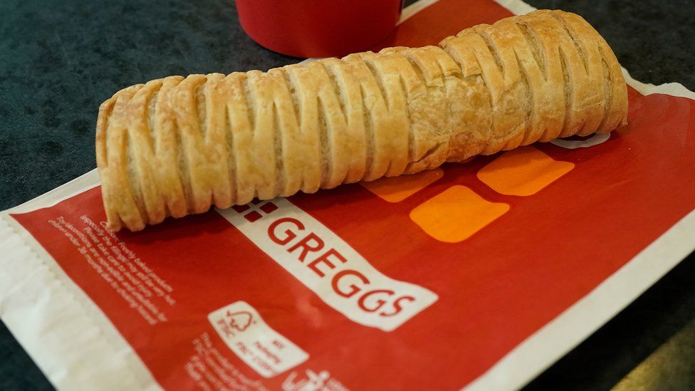 Greggs vegan sausage roll sat on a paper bag