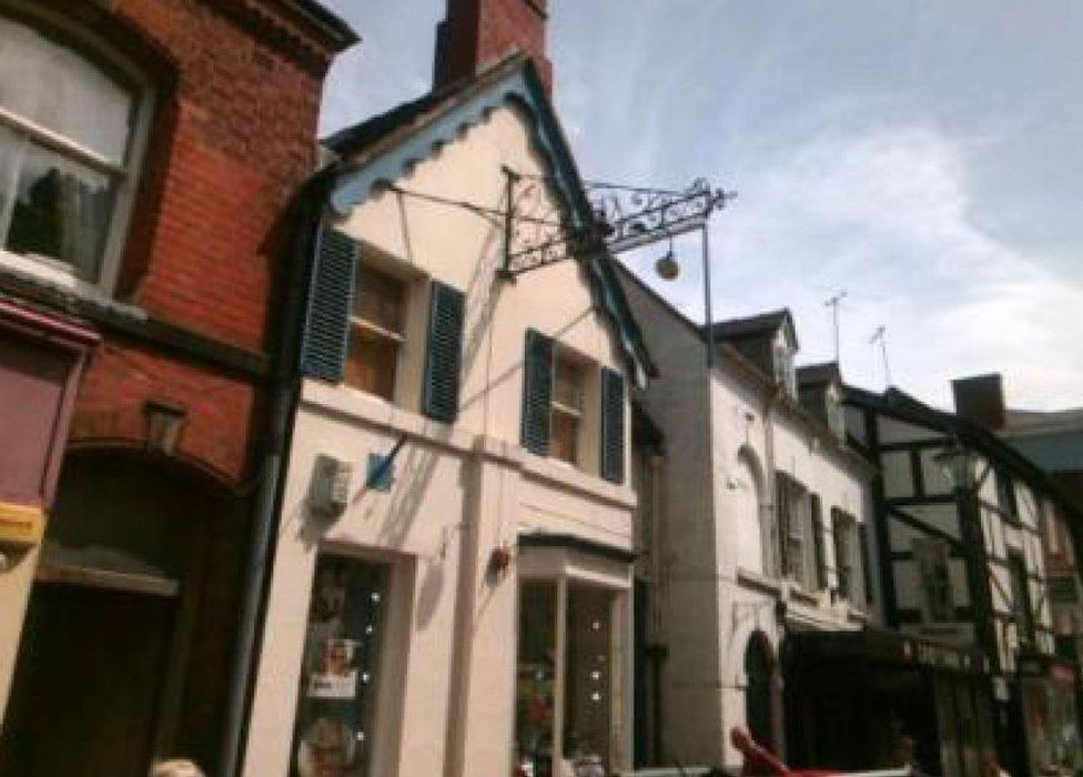 Shop sign falls on to baby in pram in Newport BBC News