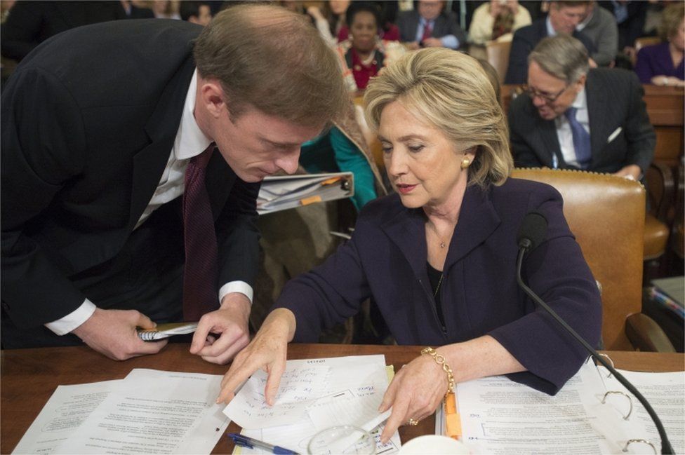 Jake Sullivan consults with former US Secretary of State Hillary Clinton during a congressional hearing