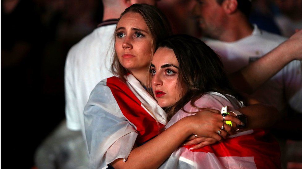 England fans are dejected after England lose the game on penalties at Vinegar Yard, London as they watch the UEFA Euro 2020 Final