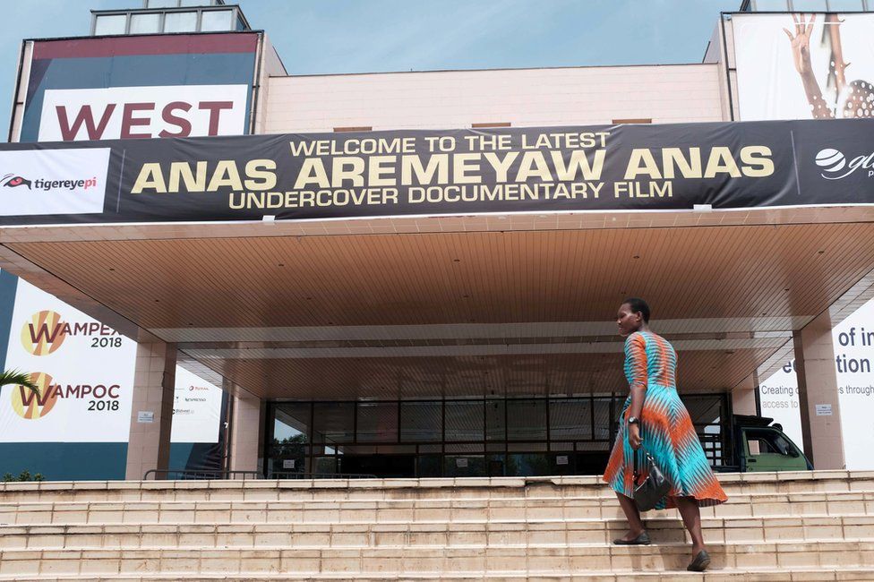 A woman walks up the stairs at the Accra International Conference Centre, where a documentary by undercover journalist Anas Aremeyaw Anas, is showing in Accra, Ghana June 7