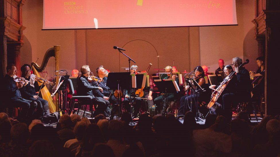 Orchestra on stage in front of the audience