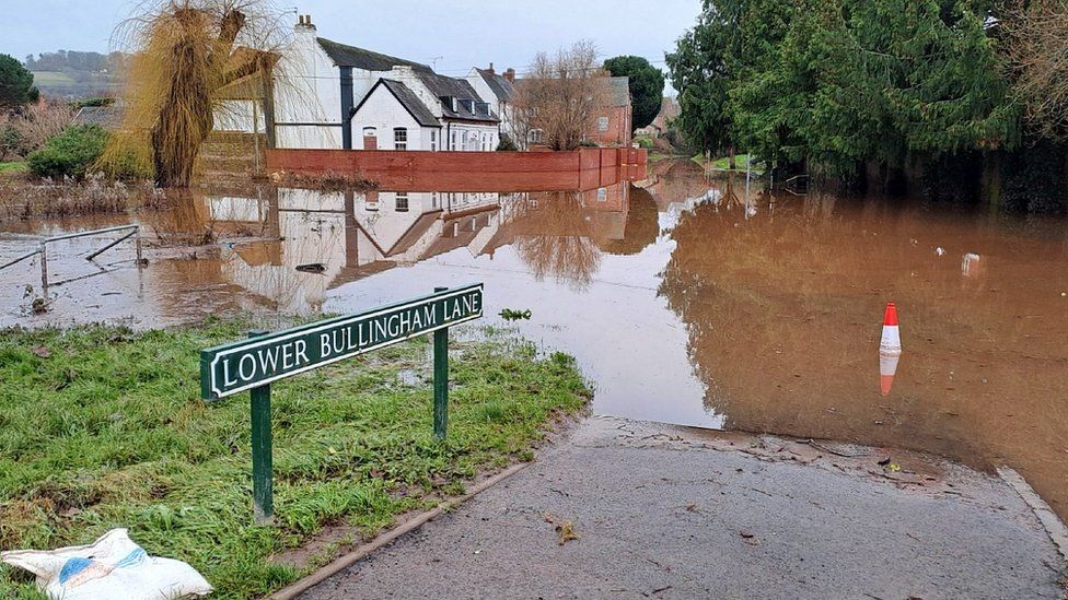 The northern end of Lower Bullingham Lane under water