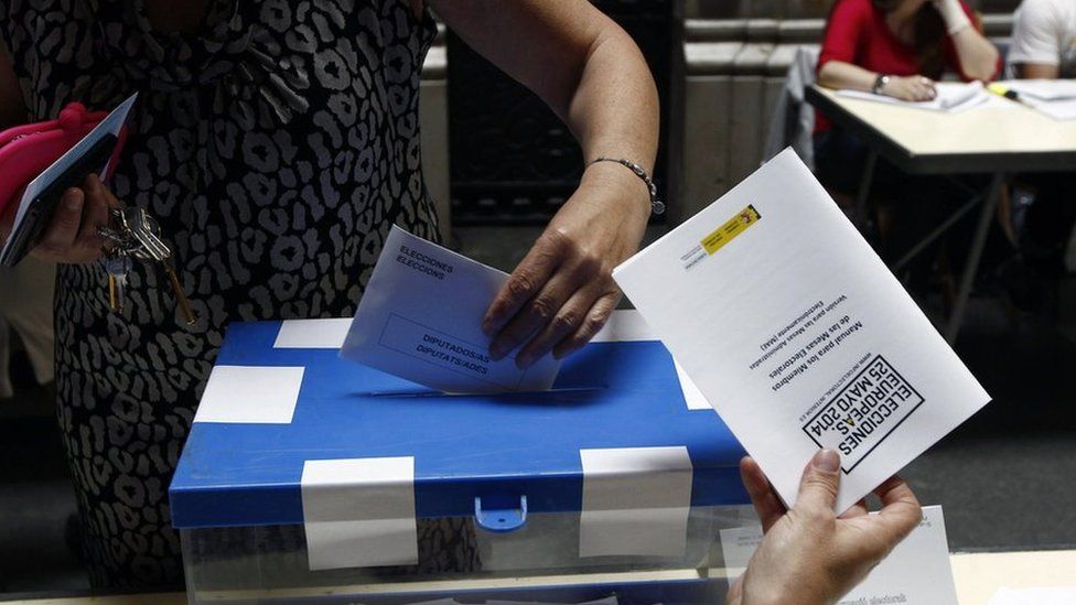 A woman casts her vote in Spain in 2014