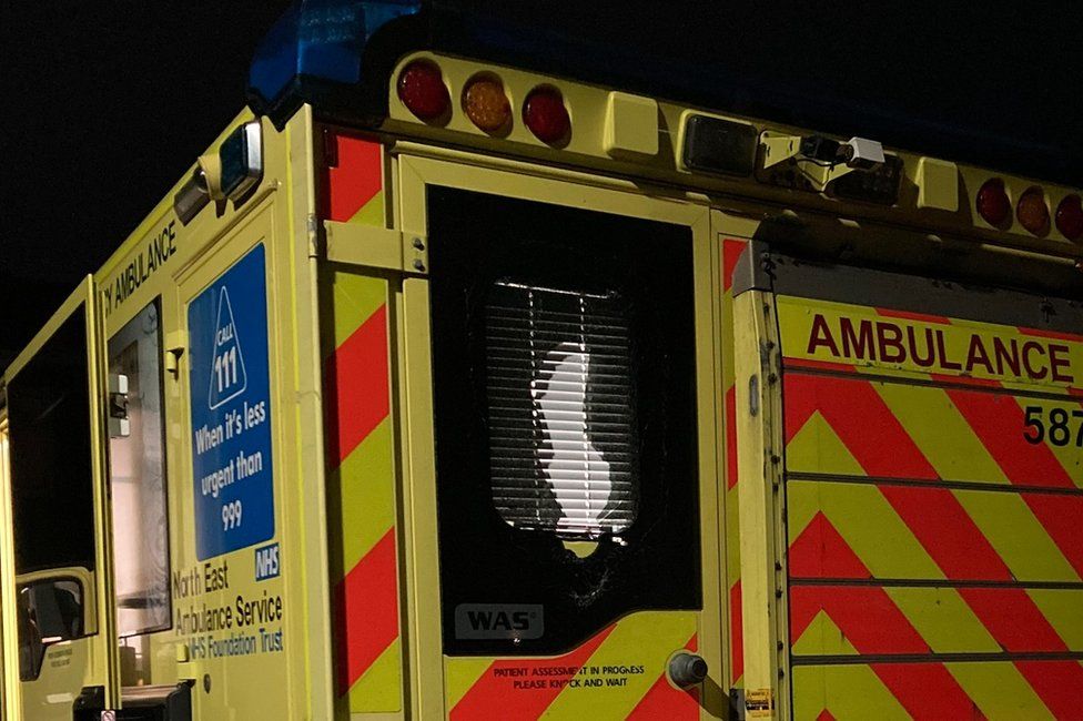 The ambulance with smashed windows