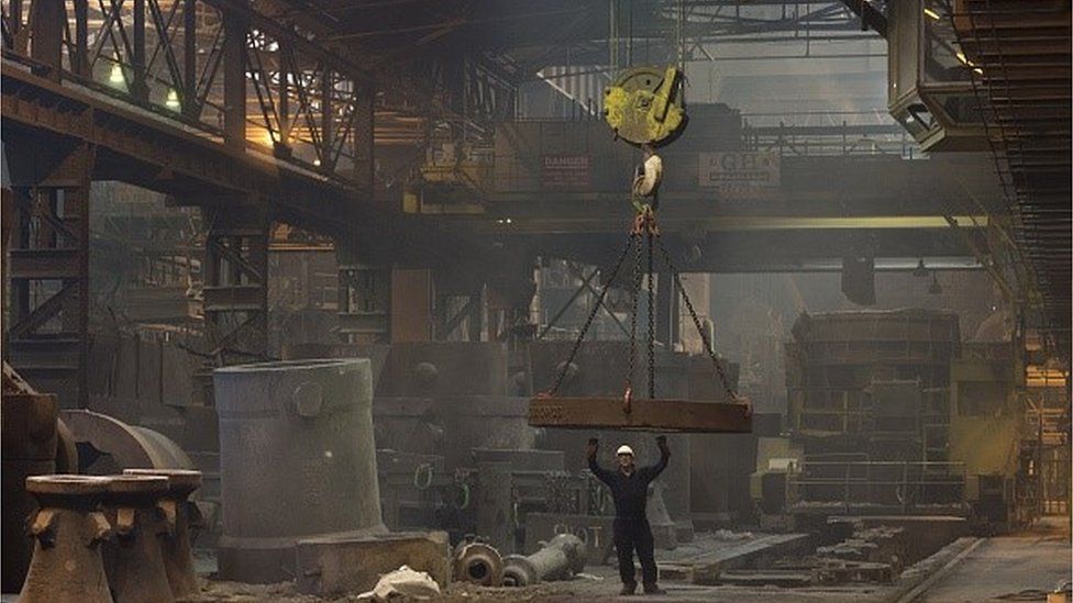 Worker casts steel ingot