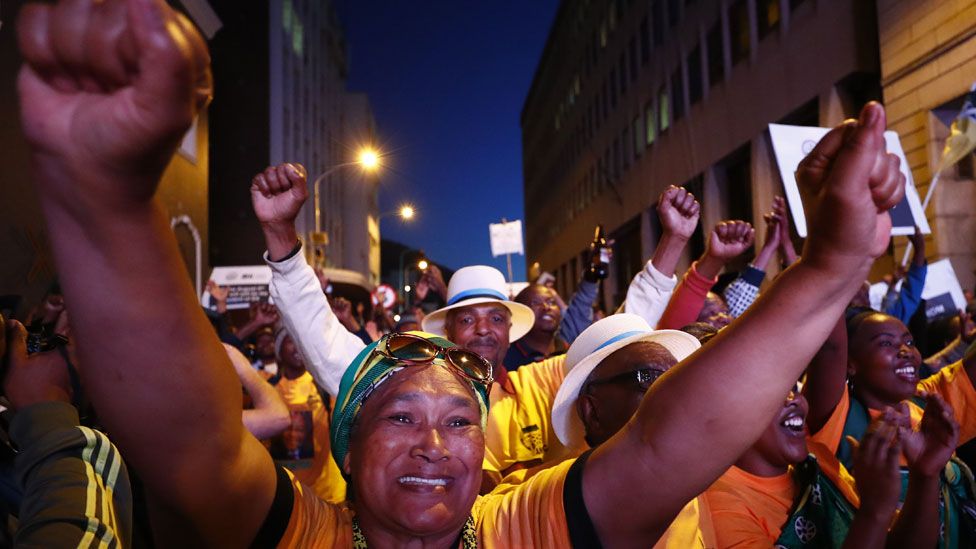 Supporters of South African president Jacob Zuma from the ruling party African National Congress (ANC) celebrate winning the vote of no confidence outside parliament in Cape Town, South Africa 08 August 2017.