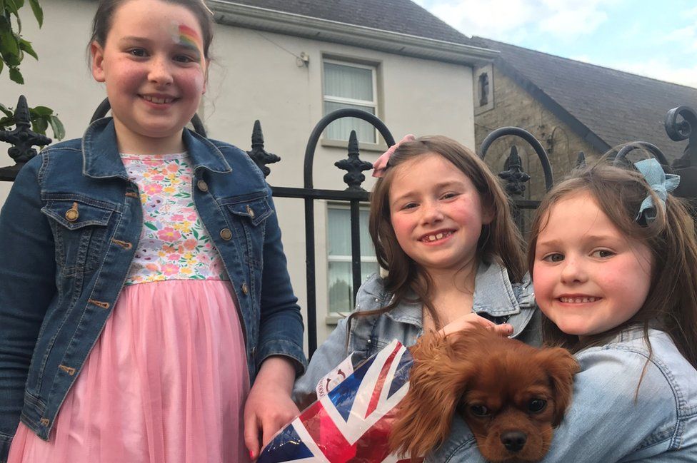 Elsie Tilly and Alex Wilson with King Charles Spaniel called Lottie watching the parade in Lisbellaw