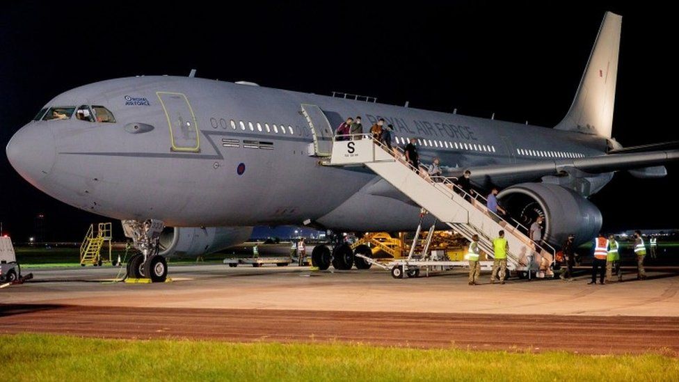 British nationals and Afghan evacuees depart a flight from Afghanistan at RAF Brize Norton on 17 August 2021
