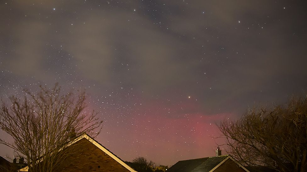 Northern Lights shine over homes in Happisburgh, Norfolk