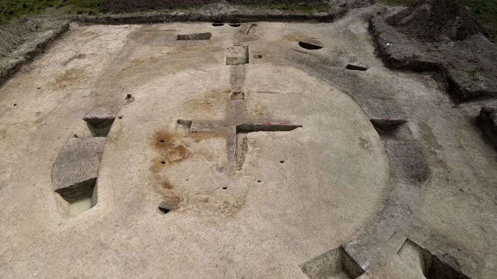 An aerial view of an excavation of a medieval mill showing the cross or X of its foundation and banks surrounding it, Cherry Hinton, Cambridgeshire 
