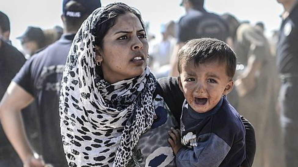 Syrian Kurdish woman with child (file photo)