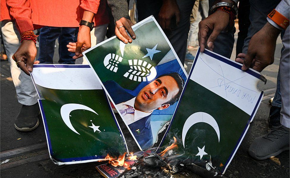 Activists of India's ruling Bharatiya Janata Party (BJP) burn placards of Pakistan's national flag and Pakistan's Foreign Minister Bilawal Bhutto Zardari, during a demonstration to protest against Bhutto Zardari's allegedly derogatory comment on India's Prime Minister Narendra Modi, in Kolkata on December 17, 2022.
