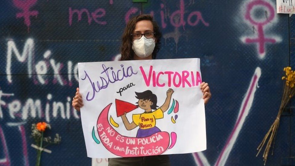 A woman demonstrates outside the Quintana Roo representation in the capital, as a protest and to pay homage to Victoria Esperanza Salazar, a Salvadoran migrant killed by police; in Mexico City, Mexico, 29 March 2021.