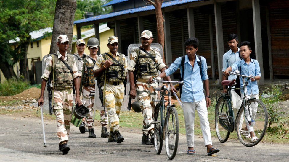Security personnel patrol Morigaon district of Assam.