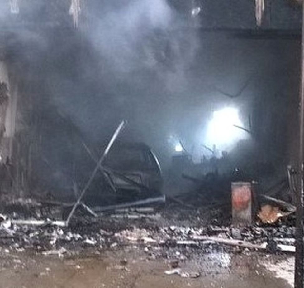 Driver flees after car smashes into Harrow shop and bursts into flames ...