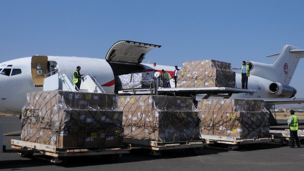 Workers unload aid shipment from a plane at the Sanaa airport, Yemen November 25, 2017
