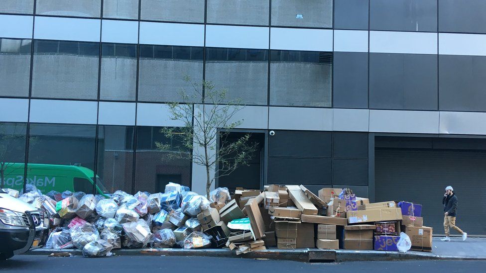 Mounds of boxes fill a New York pavement