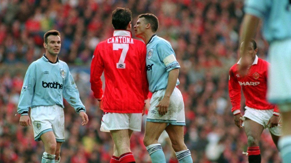 Man City's Keith Curle and Man Utd's Eric Cantona clash