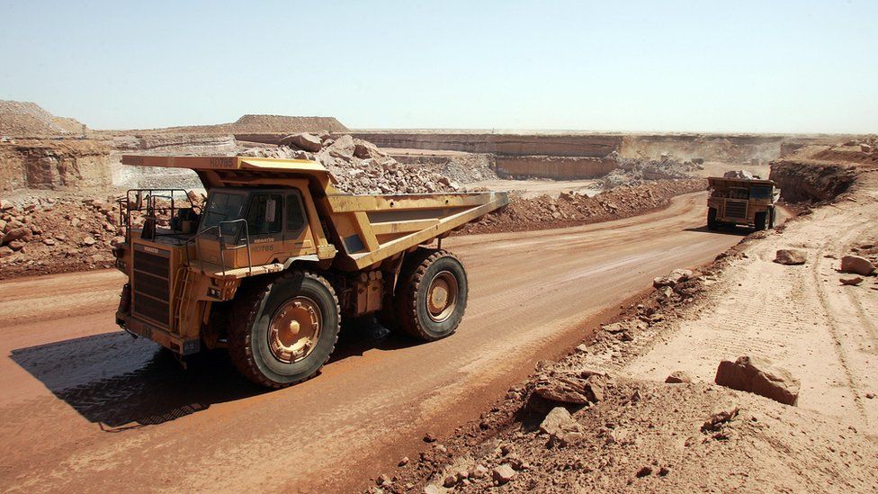 Trucks at an open cast mine in Niger