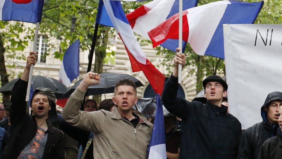 Protesters from far-right movement Generation Identitaire take part in a demonstration against migrants on May 28, 2016 in Paris