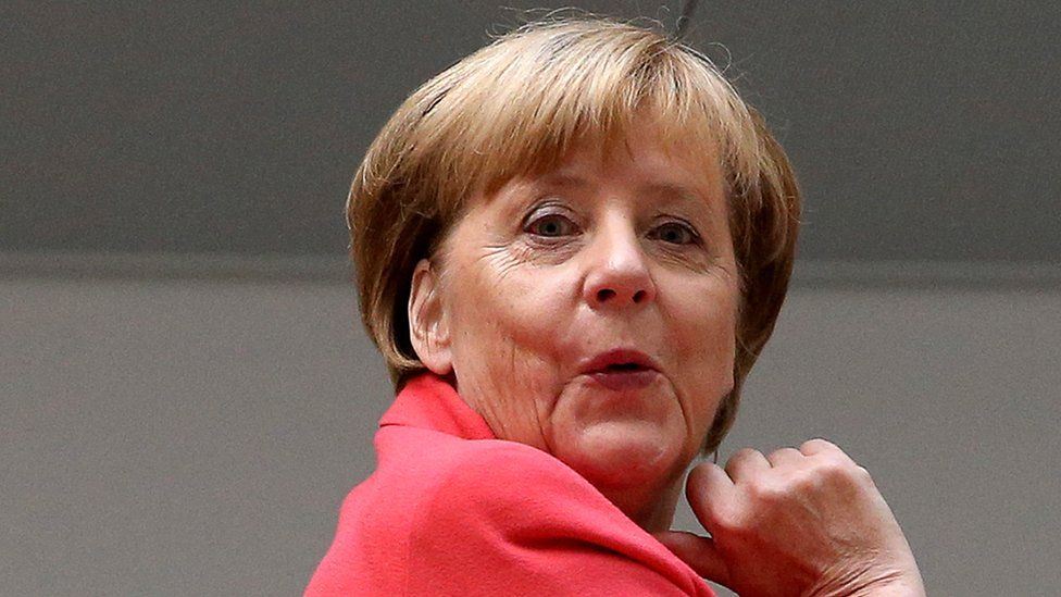 Angela Merkel reacts before a party leadership meeting in Berlin