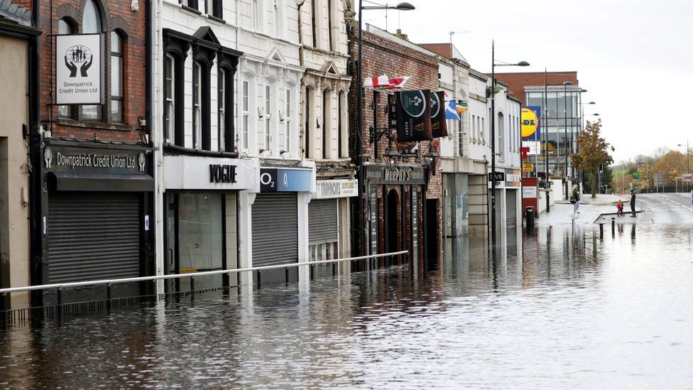 Deep floodwater outside business premises on Downpatrick's main shopping street