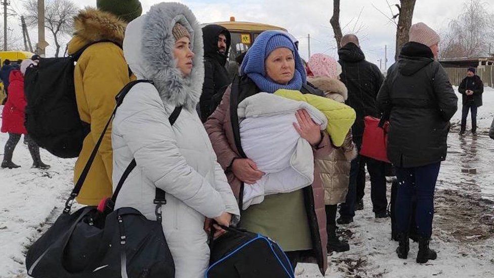 Civilians flee the city after temporary ceasefire announced on 8 March 2022 in Sumy, Ukraine