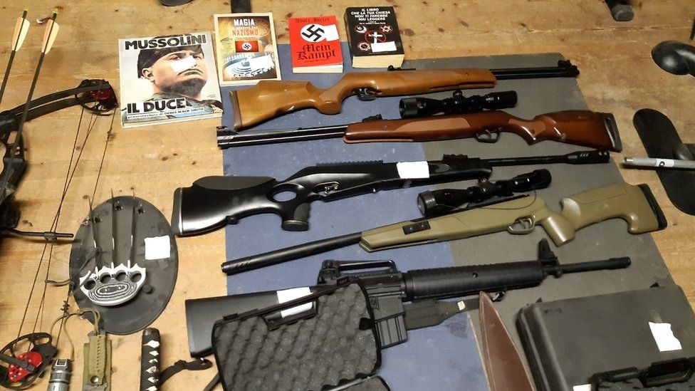 Weapons including automatic rifles that were seized in searches of properties of an extreme right group in Italy