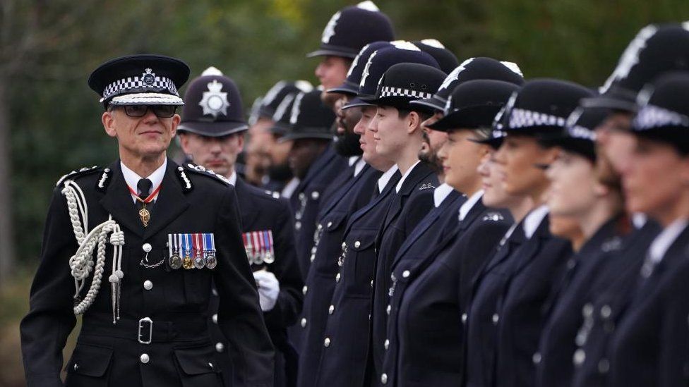 Metropolitan Police Commissioner Mark Rowley inspects new police recruits