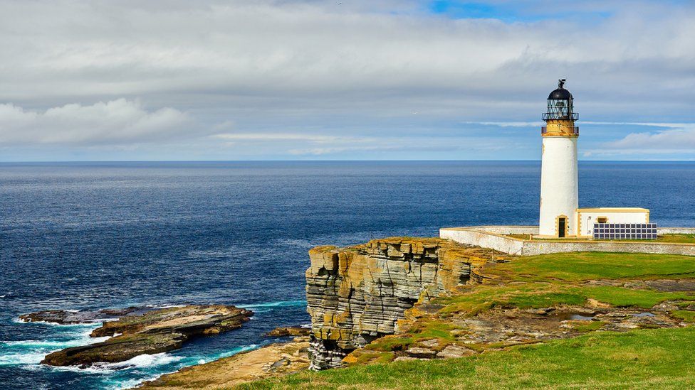 Lighthouse powered with solar energy, Westray, Orkney islands, Scotland - stock photo