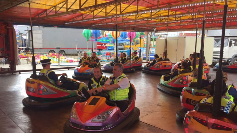 Police officers on dodgems