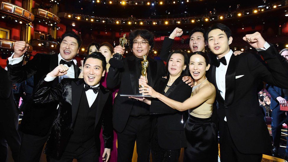 Best picture award winners Parasite pose with Oscar award