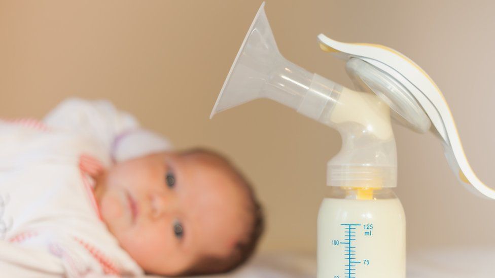 Baby and breast pump
