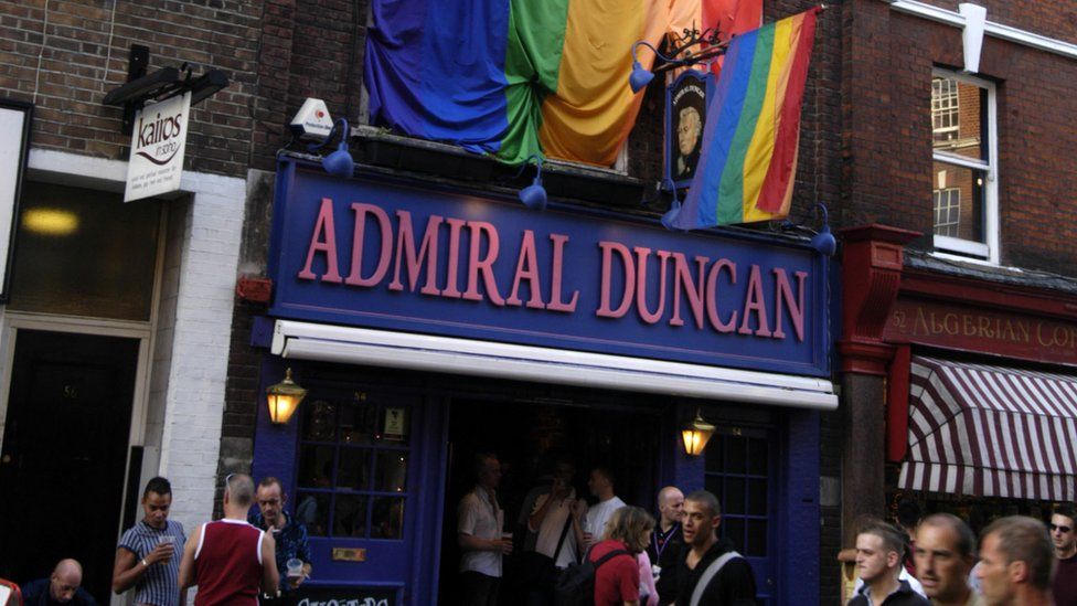 Gay rainbow flag outside Admiral Duncan pub in Old Compton Street,