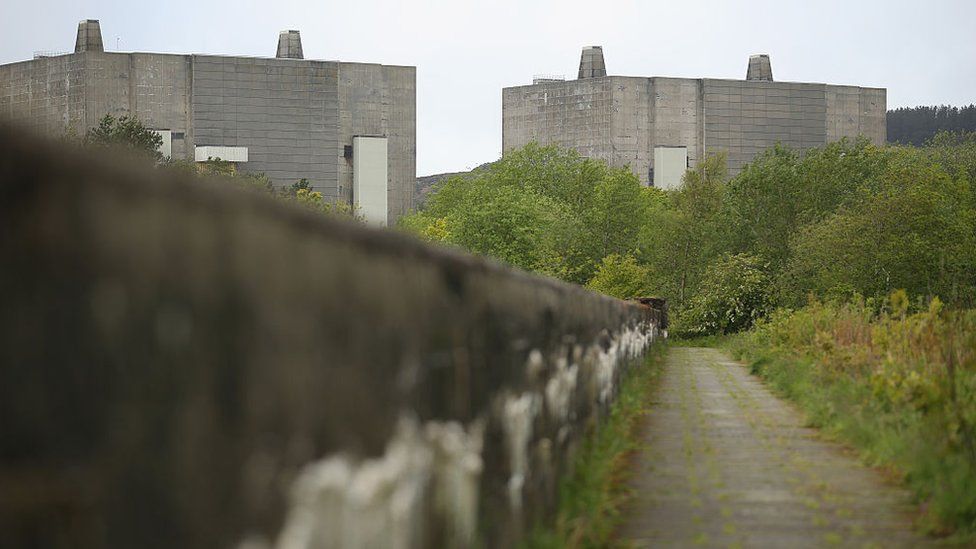 Two reactor towers at Trawsfynydd with disused overgrown path in foreground