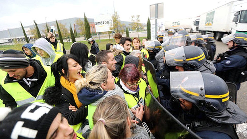 Yellow vest protestors outside an Amazon warehouse in France.