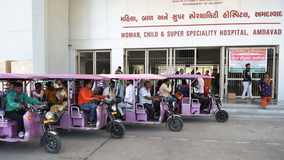 e-rickshaws parked outside a Gujarat hospital