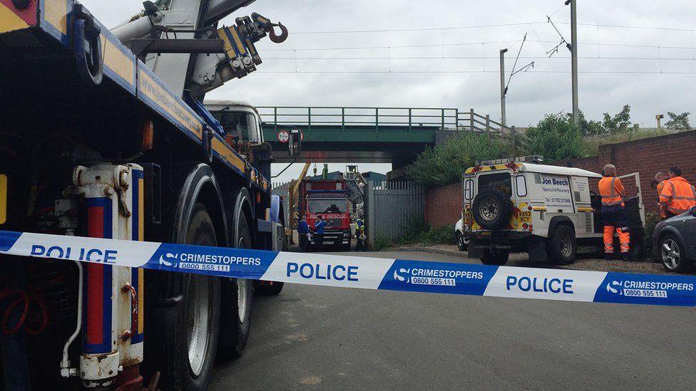Emergency services at the scene where five men died after a wall collapsed at a Hawkeswood Metal recycling plant