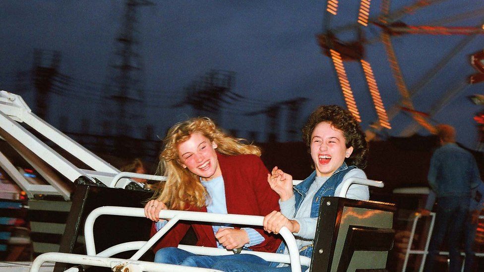 Two women on a fair ground ride