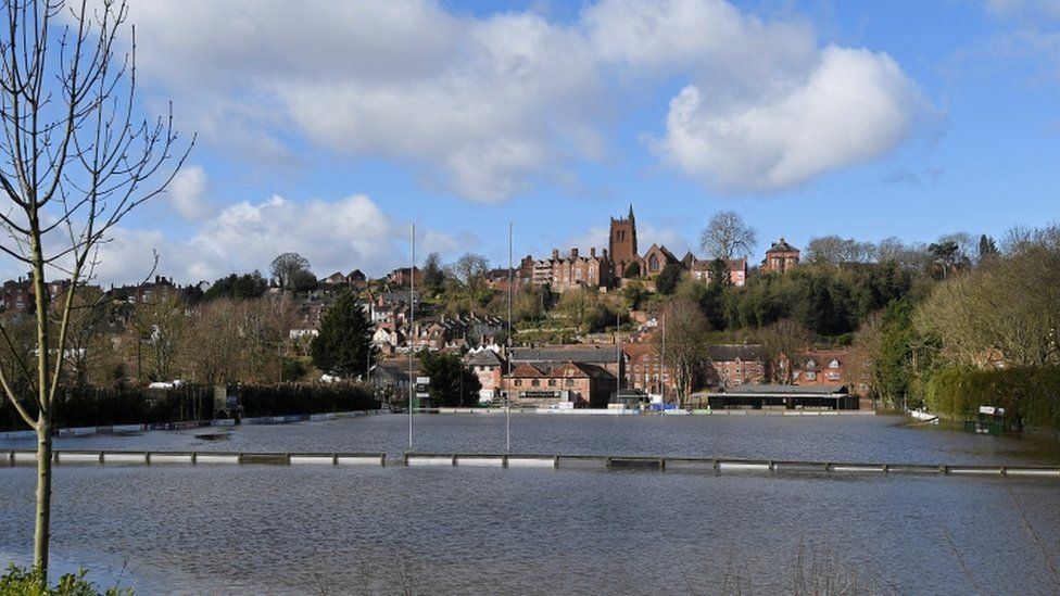 The flooded rugby ground of Bridgnorth RFC is seen beside the swollen River Severn