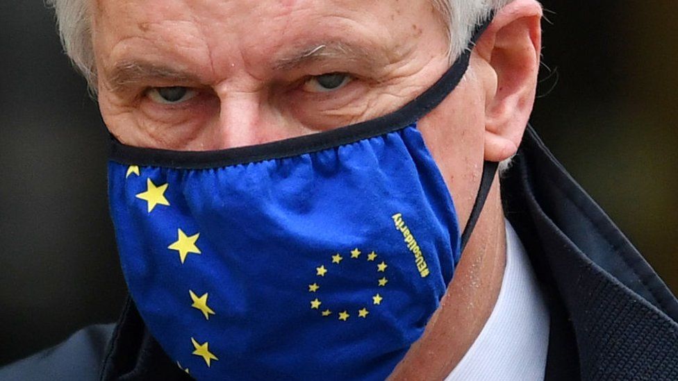 Image shows Michael Barnier in an EU flag face mask