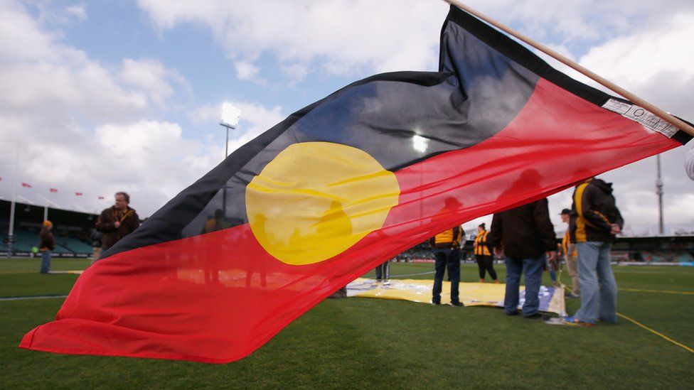 An Aboriginal flag is flown before a sporting match