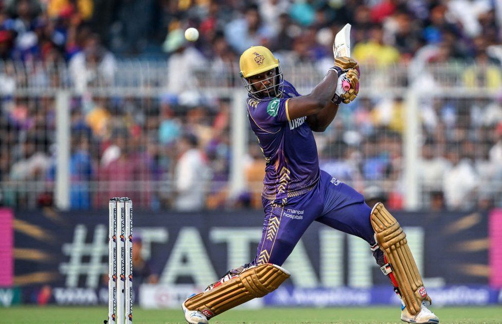Kolkata Knight Riders' Andre Russell plays a shot during the Indian Premier League (IPL) Twenty20 cricket match between Kolkata Knight Riders and Royal Challengers Bengaluru at the Eden Gardens in Kolkata on April 21, 2024.