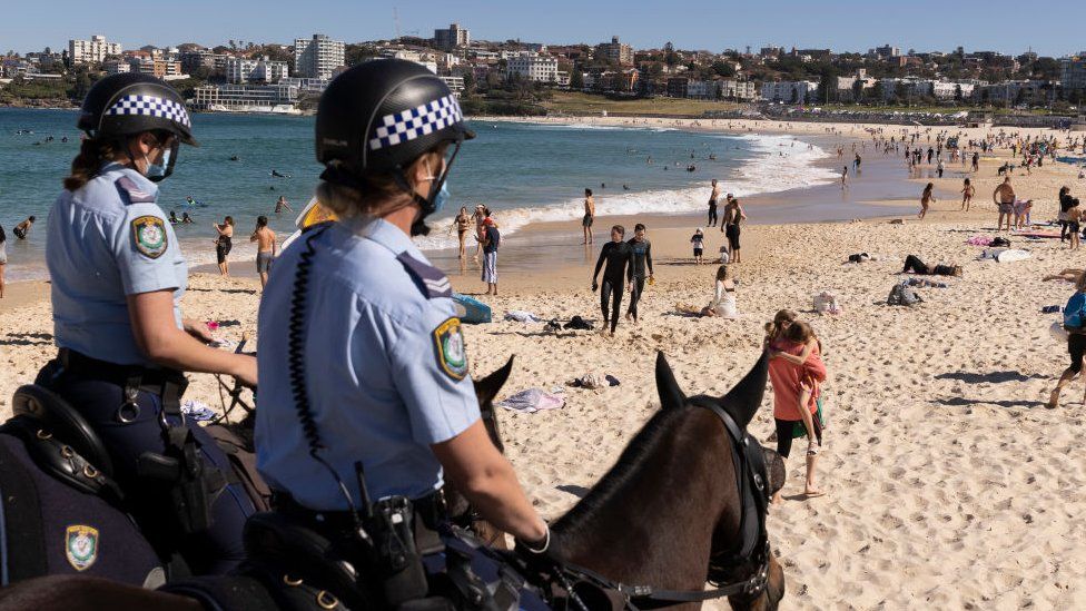 Two police officers on horses on Bondi Beach